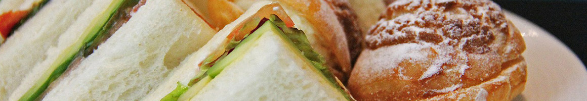 Eating Sandwich at America's Best Cuban Sandwich restaurant in Lakeland, FL.